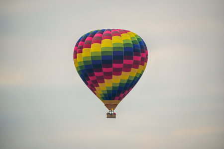 Colorful hot air balloon flying in the sky at the festival.の写真素材