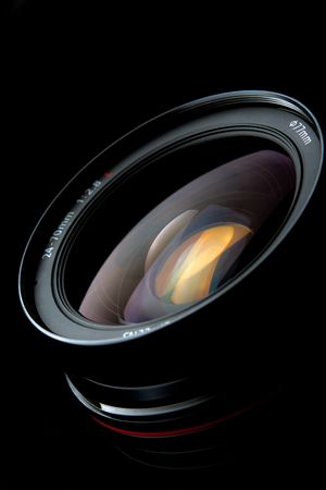 Photo lens with reflections on black backgroundの写真素材