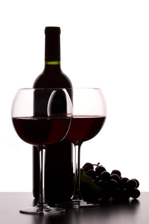 glas of red wine and bottleの写真素材