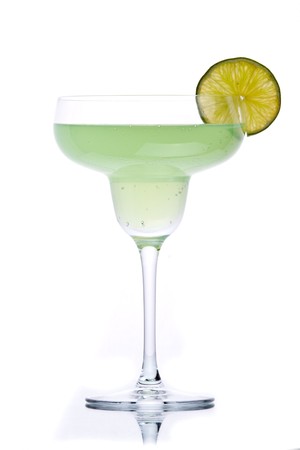 Green alcohol cocktail with green lime isolated on whiteの写真素材