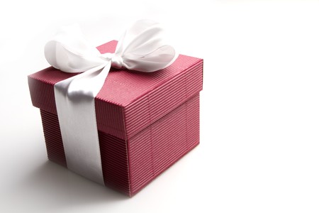 red gift with the white ribbon isolated on white background