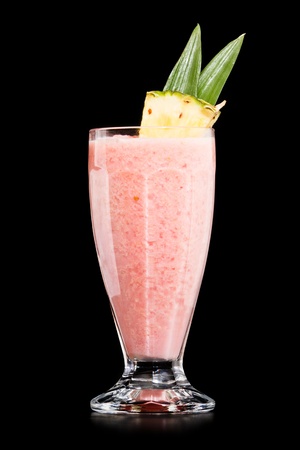 Strawberry Pina colada drink cocktail glass isolated on black backgroundの写真素材