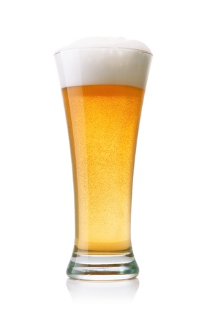 Beer into glass isolated on whiteの写真素材