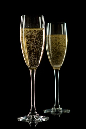 A glass of champagne, isolated on a black  background.の写真素材