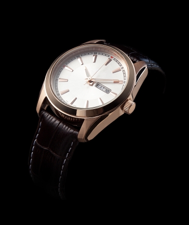 luxury watches with a leather strap on a black backgroundの写真素材