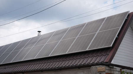 Solar panel on the roof of a building in cloudy rainy weather
