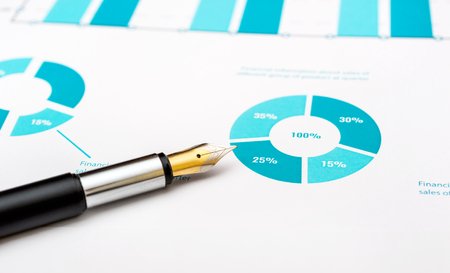 Pen on colored financial graph.の写真素材