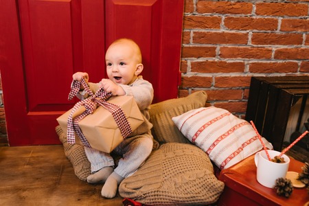 small child is happy gifts for Christmas, birthdays