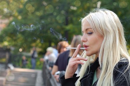 Girl smoking outdoorsの写真素材