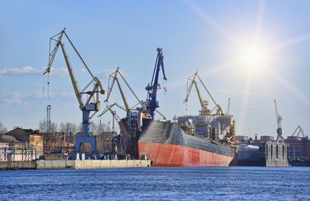 Ship in dock with elevating cranes