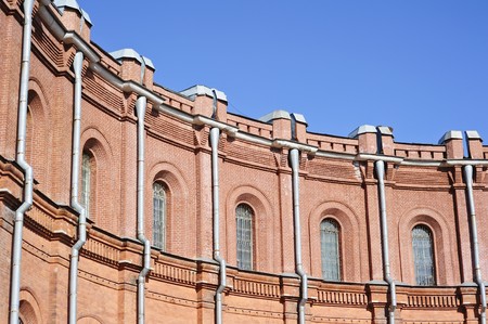 Round brick wall with windowsの写真素材