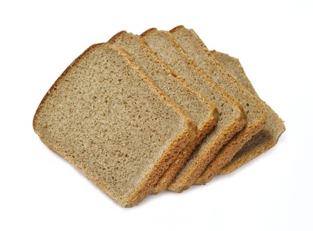 Slices of dark bread isolated over whiteの写真素材