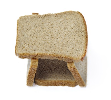 Tower of slices dark bread isolated over whiteの写真素材