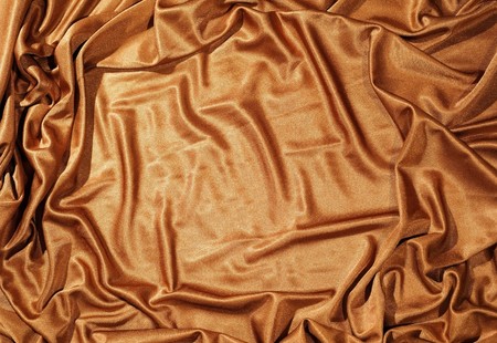 Cloth background in golden colorの写真素材
