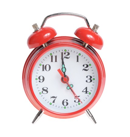 Red alarm clock isolated on white background