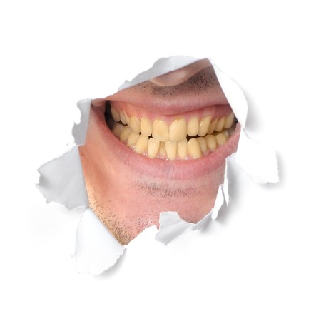 Jaws in a hole of the paperの写真素材