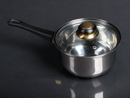 Metallic pan on black backgroundの写真素材