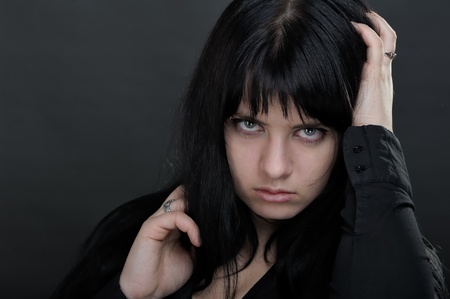 Dark woman on black backgroundの写真素材