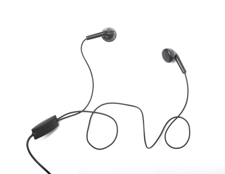 Modern portable audio earphones isolated on a white backgroundの写真素材