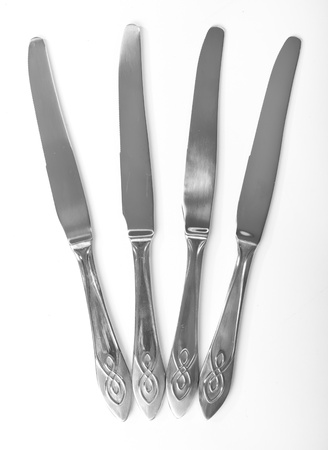 Kitchen knifes closeup isolated on white backgroundの写真素材