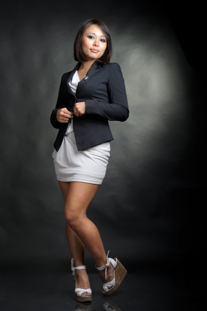 Pretty asian girl in studio on black backgroundの写真素材