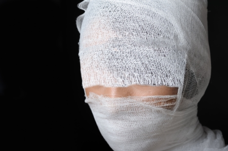 Portrait with bandaged faceの写真素材