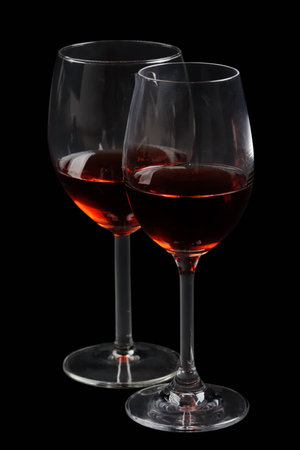 Red wine glass on black backgroundの写真素材