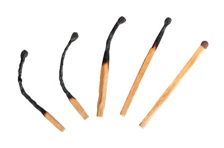 Close-up of a burnt matches isolated on a white backgroundの写真素材