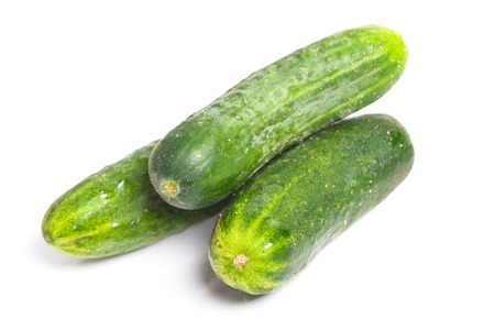Green cucumbers isolated on white backgroundの写真素材