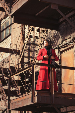 Woman in red coatの写真素材