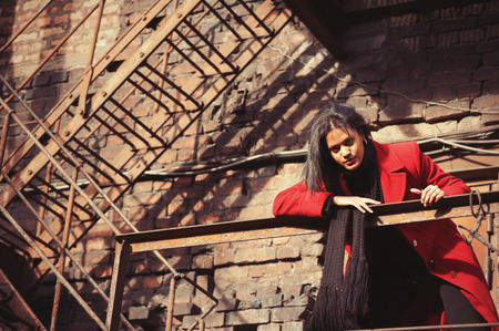 Woman in red coatの写真素材