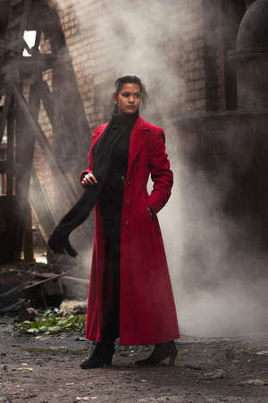 Woman in red coatの写真素材