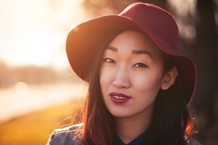 Asian woman outdoors at sunny dayの写真素材