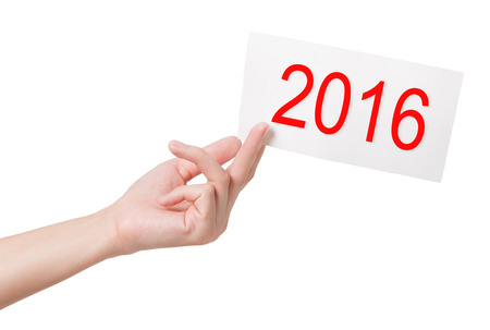 New year card in woman hand isolated on white backgroundの写真素材