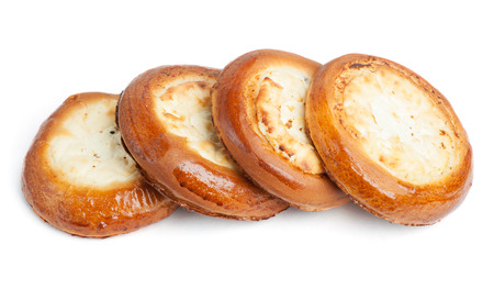 Traditional russian baking: round buns with cottage cheese (vatrushka) isolated on white backgroundの写真素材