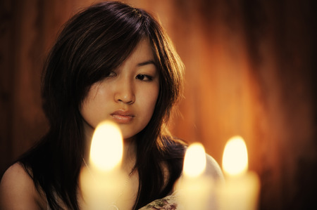 Portrait of asian woman with candlesの写真素材