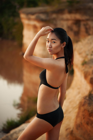 Beautiful asian woman in black bikiniの写真素材