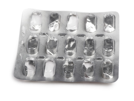 Empty pack of pills isolated on white background