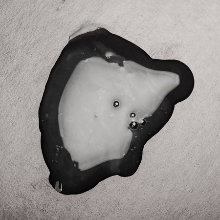 Close up puddle of oilの写真素材