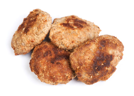Group of prepared small hand made cutlets isolated over white