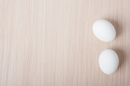 Eggs on the wooden tableの写真素材