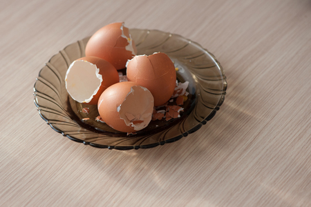 Broken eggs shell on plate