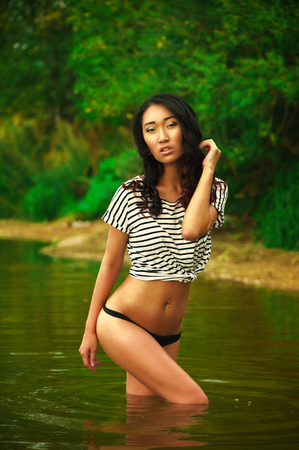 Beautiful woman in underpants at natureの写真素材