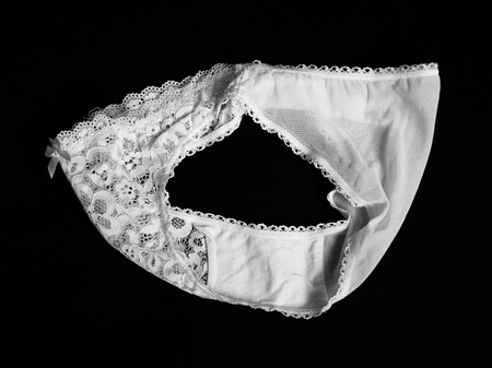White lace underpants on black backgroundの写真素材