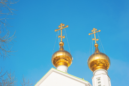 Dome of the temple with golden crossの写真素材