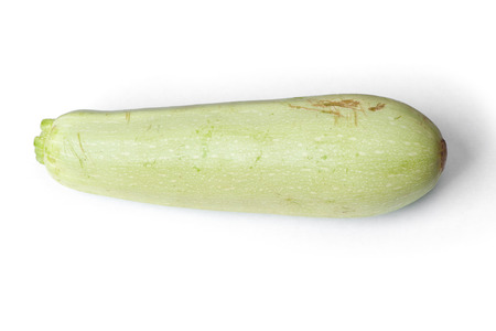 Single damaged squash vegetable marrow zucchini isolated on white backgroundの写真素材