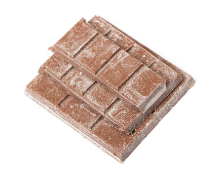 Close up of segment chocolate bar isolated on white backgroundの写真素材