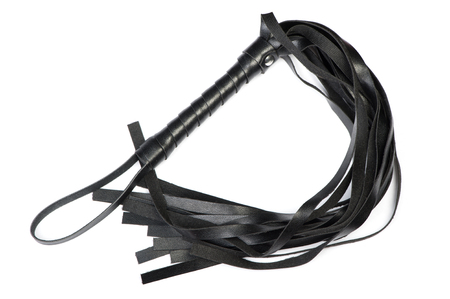 Kinky and fetish leather whip isolated on white backgroundの写真素材