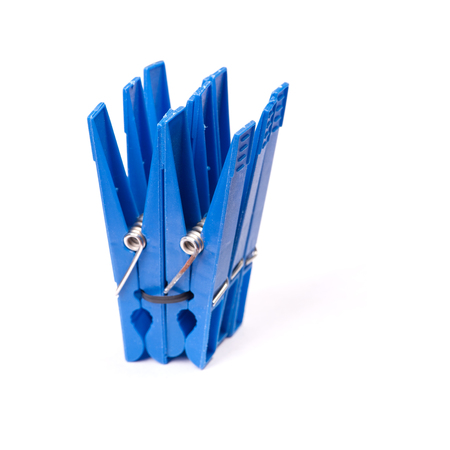 Blue plastic clothespins isolated on white backgroundの写真素材
