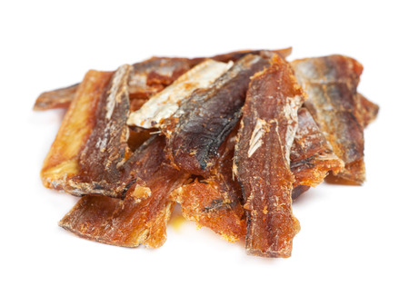 Pieces of cleaned dried fish isolated on white (Dry Peppered Pollack)の写真素材